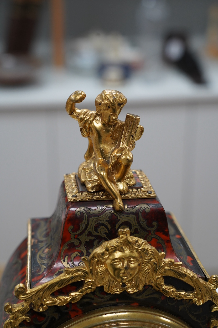 A late 19th century French boullework mantel clock, with key and pendulum, 40cm. Condition - fair to good, not tested as working